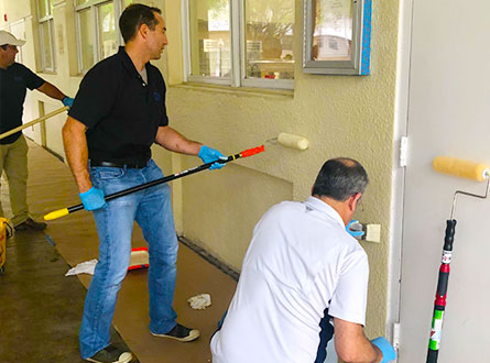 Volunteers painting the facility